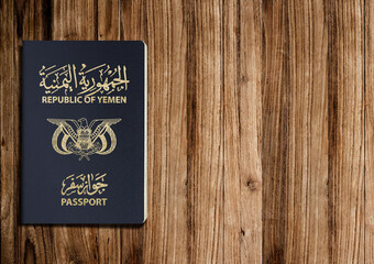 Yemeni passport on a wooden background ,A Yemeni passport is a government document used by citizens of Yemen for international travel
