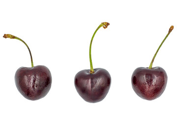 Ripe cherries in glass isolated on white background