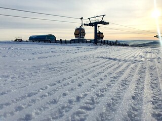 Morning on the prepared ski track. Sunset on the ski slope