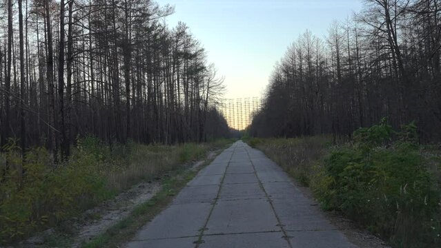 Way to the Duga - horizon radar systems in Chernobyl, Ukraine. Soviet over-the-horizon military radar station also known as Russian woodpecker Steel. High quality 4k footage