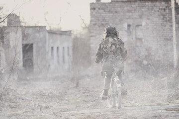 War and the child. Little scared boy in the ruins of the house.

