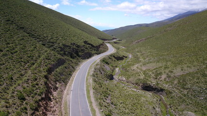 beautiful mountain road in green landscape in northwest Argentin