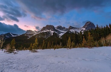 Fototapeta na wymiar Winter Sunrise Over A Snowy Mountain Park