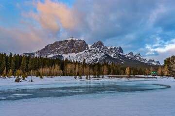 Frozen Lake In The Canmore Mountains At Sunrise