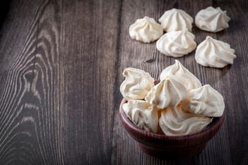 Delicious meringue cookies on the table.