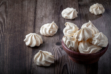 Delicious meringue cookies on the table.
