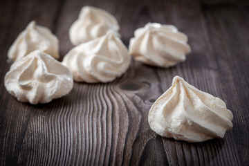 Delicious meringue cookies on the table.