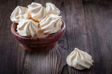 Delicious meringue cookies on the table.