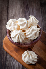 Delicious meringue cookies on the table.