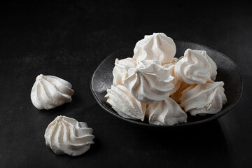 Delicious meringue cookies on the table.