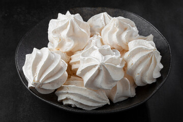 Delicious meringue cookies on the table.