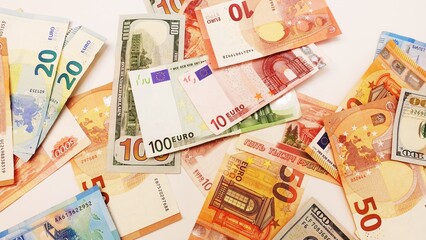 Top view of bundles of money in various currencies. Dollars, euros and rubles. The global economic crisis. Financial literacy. Currency basket