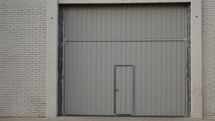 Obraz na płótnie Canvas metal door from a factory building