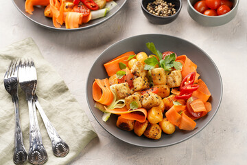 Sweet potato gnocchi with teriyaki tofu with indonesian vegetable salad gado gado - carrots,...