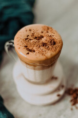 Cup with dalgona coffee on the table