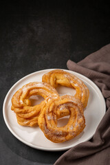 Sugared donuts on the table. Brazilian donuts.