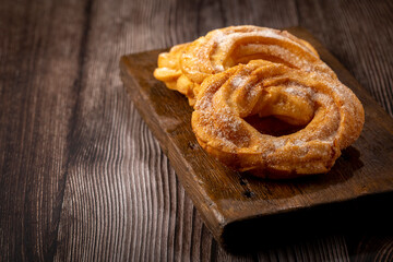 Sugared donuts on the table. Brazilian donuts.