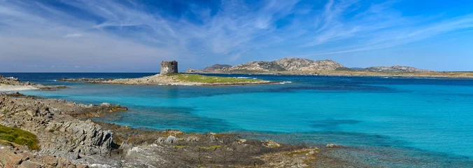 Wallpaper murals La Pelosa Beach, Sardinia, Italy Beautiful panoramic view of Pelosa Beach (Spiaggia Della Pelosa). Stintino. La Pelosa beach, probably the most beautiful beach in Sardinia, Italy. Popular travel destination. Mediterranean seacoast.