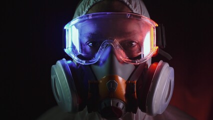 Man in protective costume suit, gas protect medical antibacterial antiviral spray paint mask....