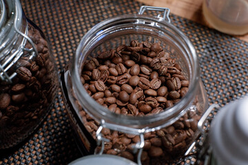 Fototapeta premium coffee in glass jar at barista table. top view