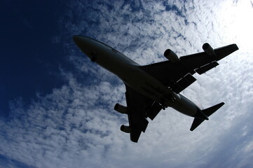 Silhouette of airplane in evening sky