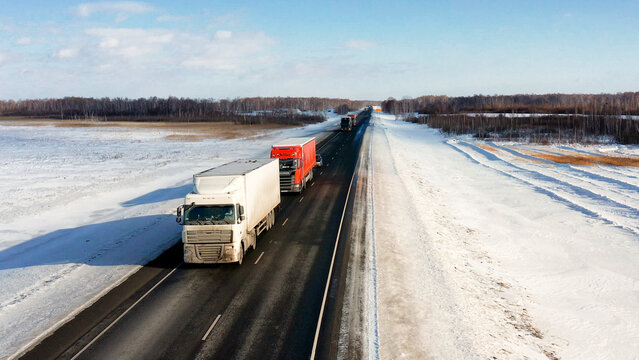 Trans-Siberian highway. Traffic on the Omsk - Novosibirsk AH6 "Irtysh" highway. Aerial view.
