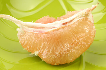 peeled pomelo pieces isolated  background. Tasty fresh fruit eating concept.