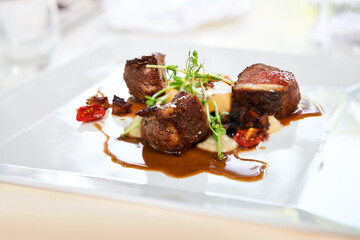 Delicious cuisine. A plate of well-presented gourmet food.