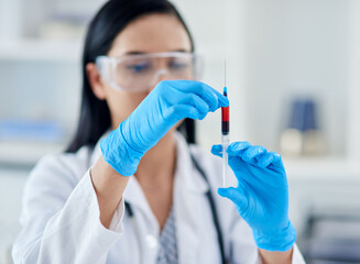 What does this patients blood say about their health. Shot of a young scientist conducting an experiment in a laboratory.