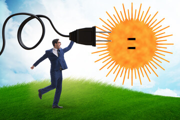 Businessman in solar energy concept