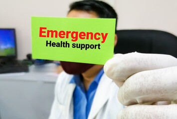 Emergency health support term on card in doctor hand. medical and healthcare concept.