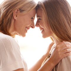 You really do light up my life. A mother and daughter standing face to face and showing each other...