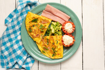 Ham omelette with avocado and tomato