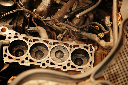 Engine repair. cylinder head gasket replacement in the workshop . Maintenance repair at car service station for diagnosis. High quality photo