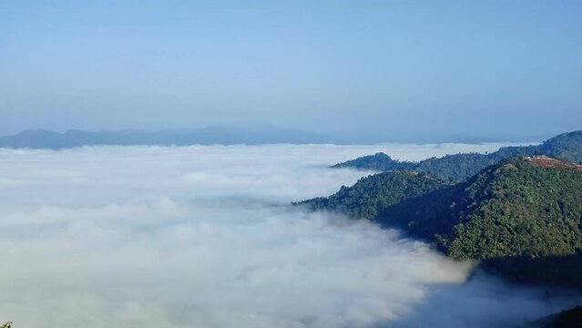 Time Lapse video 4k, Scenery of a Misty morning in the mountains at Klo Se Lo viewpoint  Mae Sam Laep, Sop Moei District, Mae Hong Son, Thailand. Low clouds and fog rolling over green forest