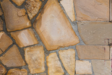 Background of brown-gray stone wall  . Pattern of slate wall texture and background
