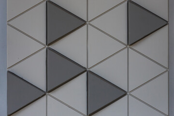 Gray mosaic background tiles. Closeup cleaning geometric mosaic   street wall texture background