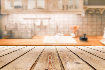 Empty wooden table and blurred kitchen background for display or montage your products.