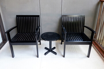 empty wood table and chairs on the terrace at  hotel