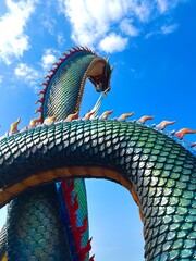 A blue dragon in the sky
