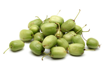 mini kiwi baby fruit (actinidia arguta) on white background 