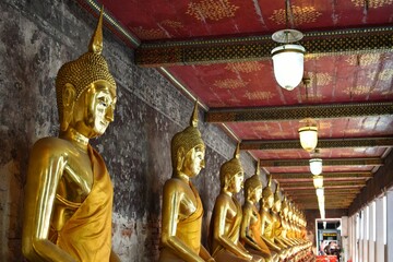 Every Buddha statue is coated in gold color at Wat Suthat Thepwararam, a temple near the Giant...