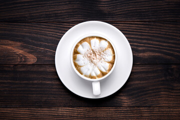 top view cup of latte on wooden table.