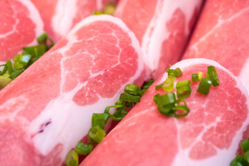 Close up fresh raw pork slices for shabu or bbq