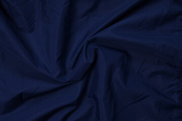 Obraz premium Blue fabric texture, background. folds close up. classic blue pantone