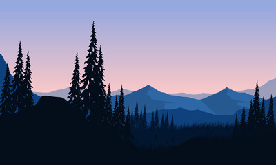 Beautiful mountain view from the edge of the city at dusk with the silhouette of the shady tree branches around it