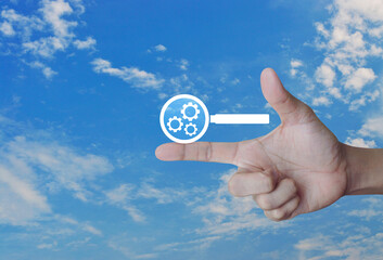 seo flat icon on finger over blue sky with white clouds, Technology search engine optimization...