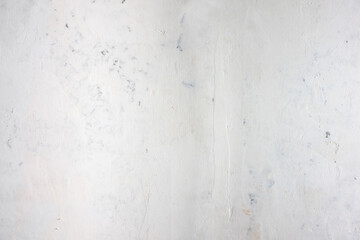 Abstract background of a plastered wall after dismantling the wallpaper.