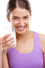 Keep calm and drink milk. Portrait of a beautiful woman holding a glass of milk.