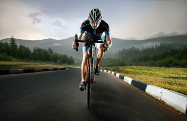 Sport. The cyclist rides. Autumn background.
 - obrazy, fototapety, plakaty